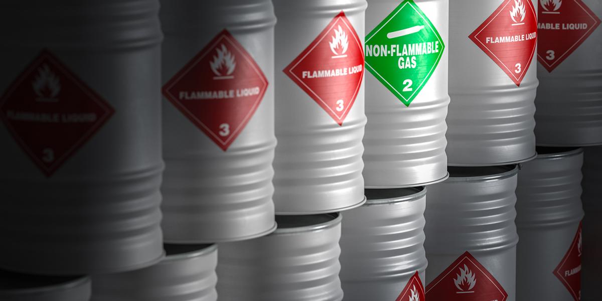 chemical-barrels-with-hazard-signs-red-green