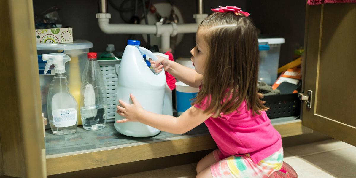 child-getting-into-chemicals-under-sink