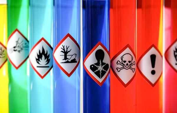 hazardous chemicals in lab tubes with labels and colorful liquids