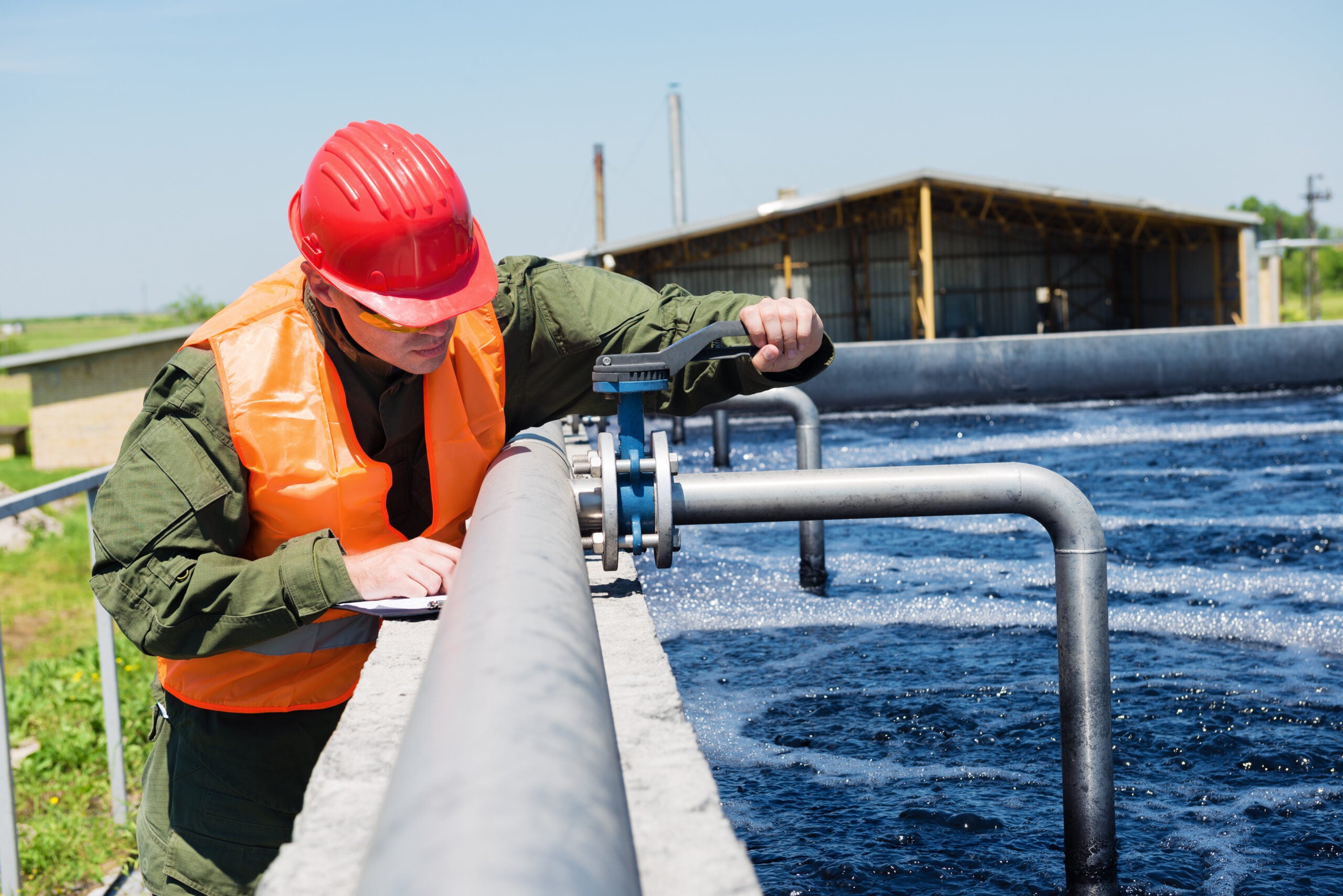 An engineer controlling a quality of water ,aerated activated sl