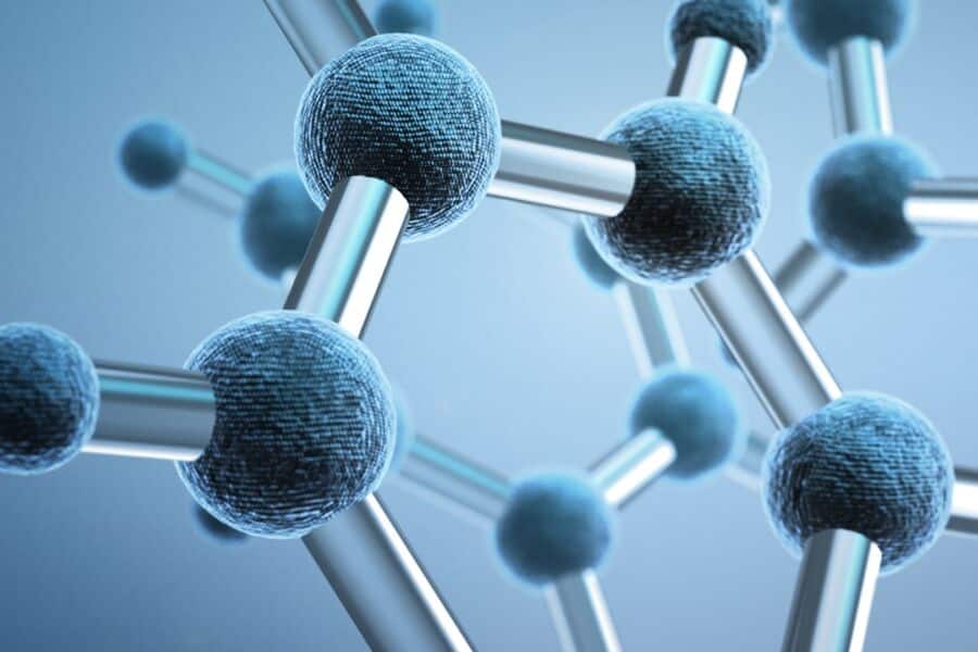 Workers at chemical facility reading tablet