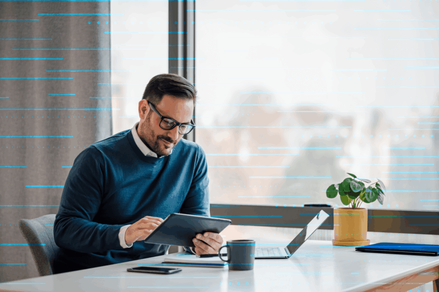 Office worker with laptop and tablet
