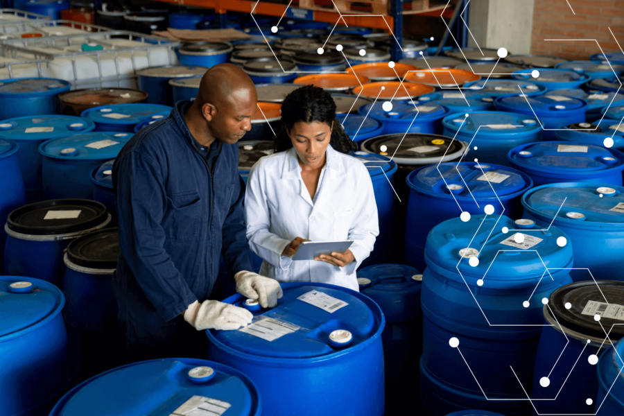 Workers at chemical facility reading tablet
