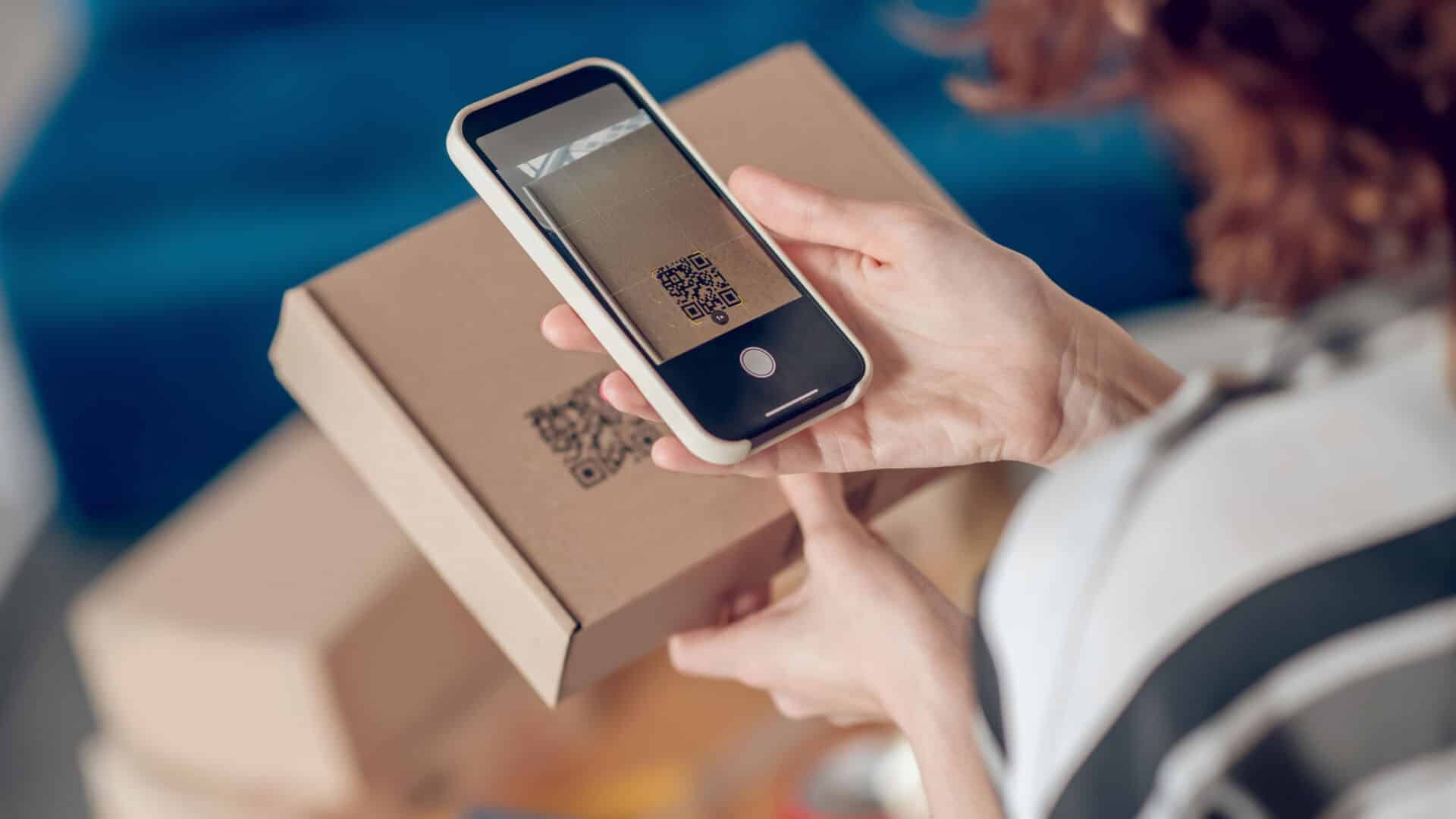 worker scanning information on the product package