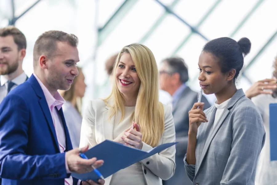 Group of business people attending a meeting in the office building lobby
