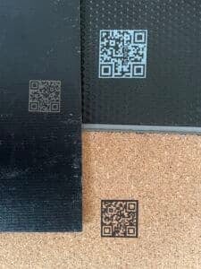 Flooring samples with QR codes directing to Digital Product Passports hosted on 3E Exchange