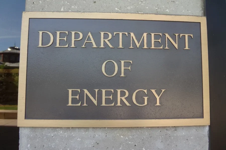 An image of the U.S. Department of Energy headquarters sign symbolizing regulatory changes and government action.