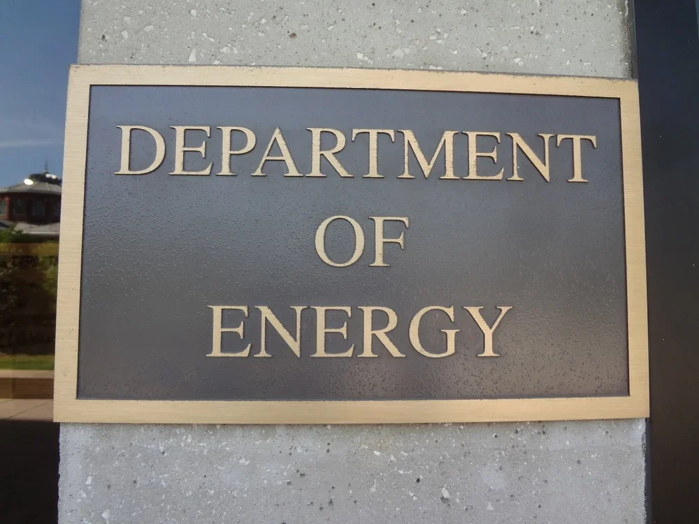 An image of the U.S. Department of Energy headquarters sign symbolizing regulatory changes and government action.