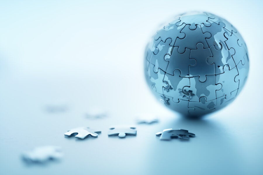 Global strategy solution concept - earth jigsaw puzzle