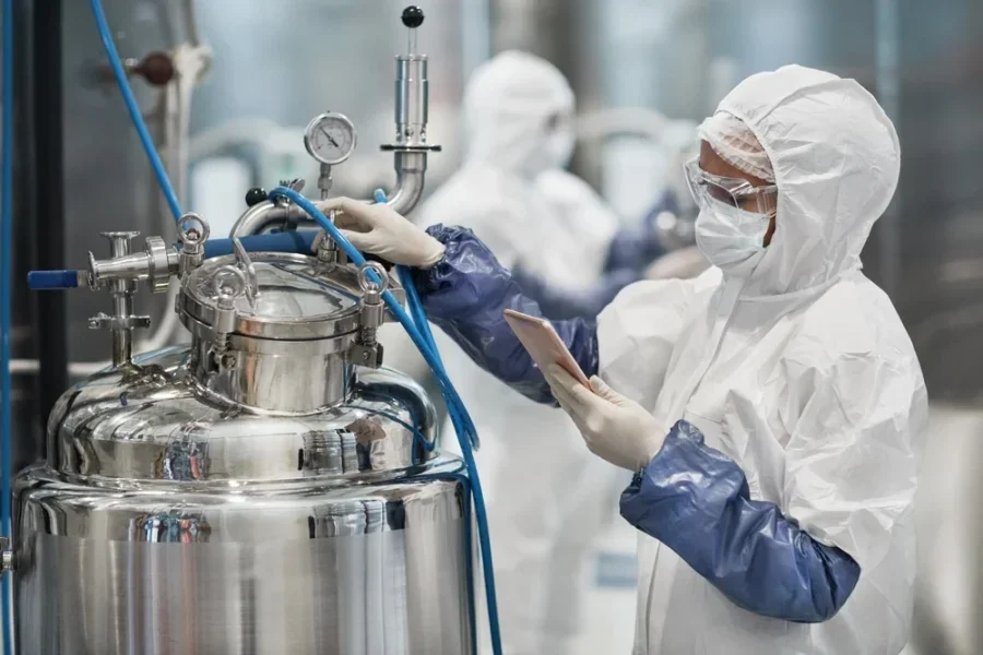 Chemists in a laboratory analyzing chemical contaminants of emerging concern (CECs) to understand their environmental and health impacts.