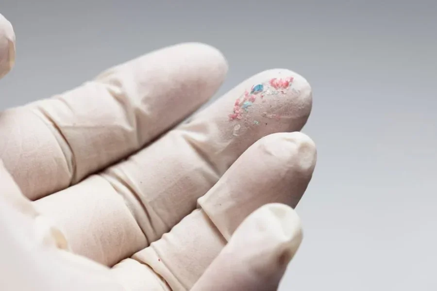 A close-up of microplastic particles, highlighting their environmental and health impacts as physical contaminants of emerging concern (CECs).