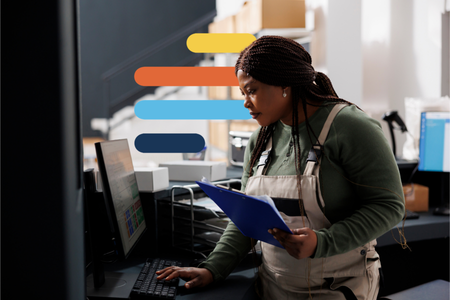Image from The regulatory change report 2026, “From regulatory change to business impact,” showing a warehouse worker reviewing a clipboard at a computer.